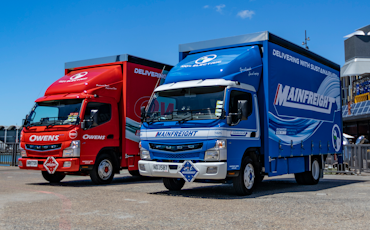 Mainfreight and Owens' FUSO eCanter curtainsiders from Keith Andrews.