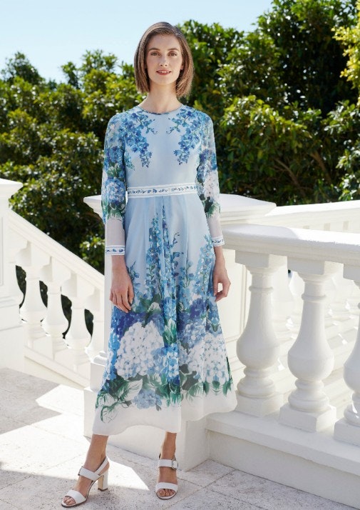 Woman in blue floral dress