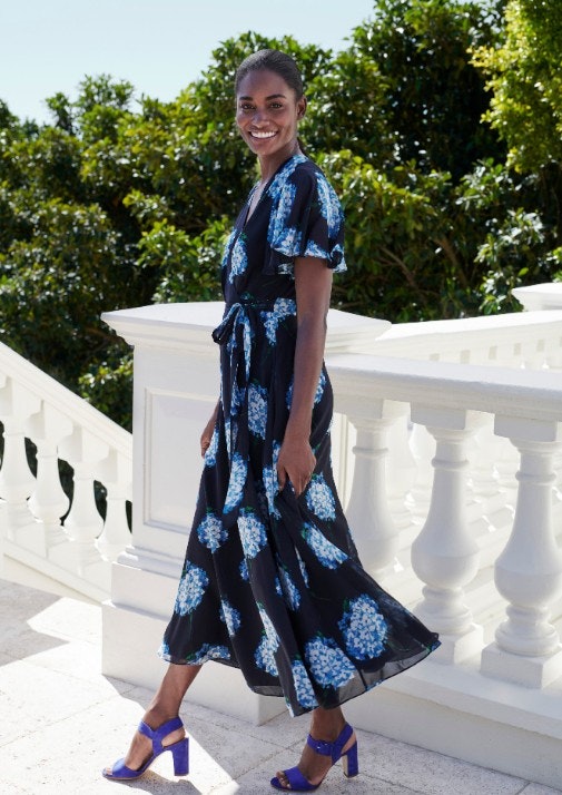 Woman in black and blue dress