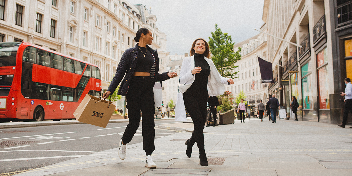 Two women on highstreet with shopping bags