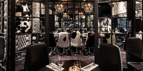 Dinner table and chairs inside a restaurant