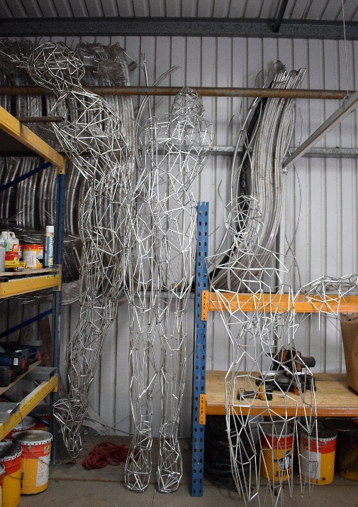 Wire frame of Christmas light statue in a shed