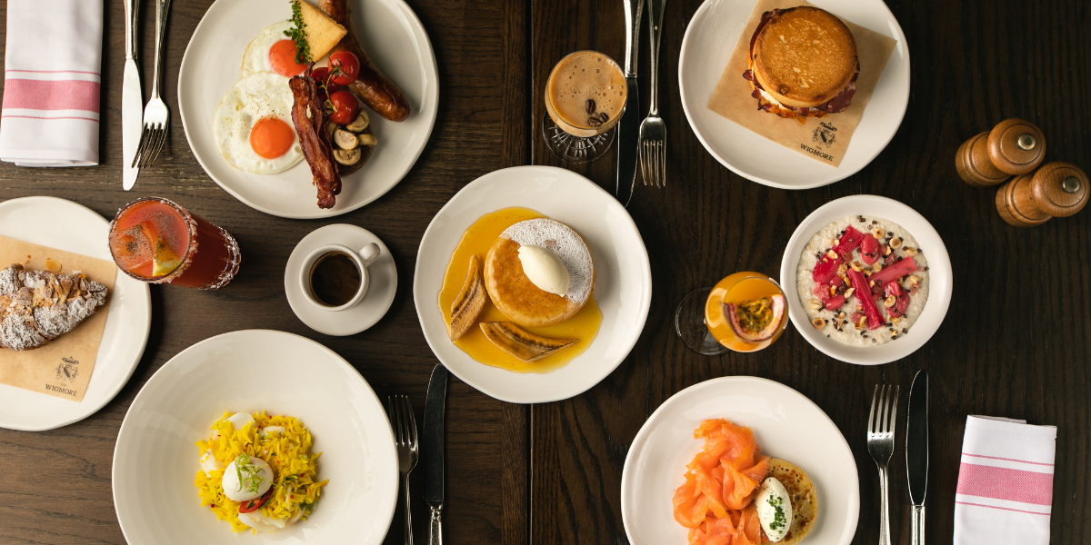 Table with different bowls of food and drinks on it