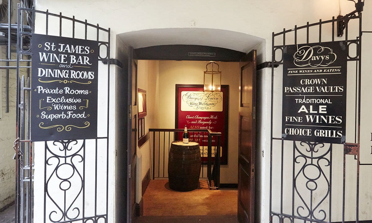 Outside view of a restaurant with black bar gates