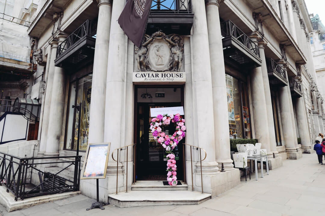 Pink balloons outside Caviar House