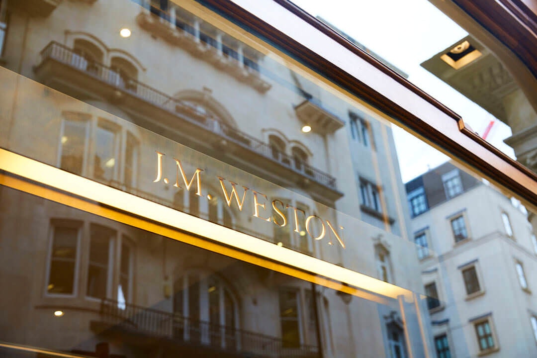 JM Weston logo in window