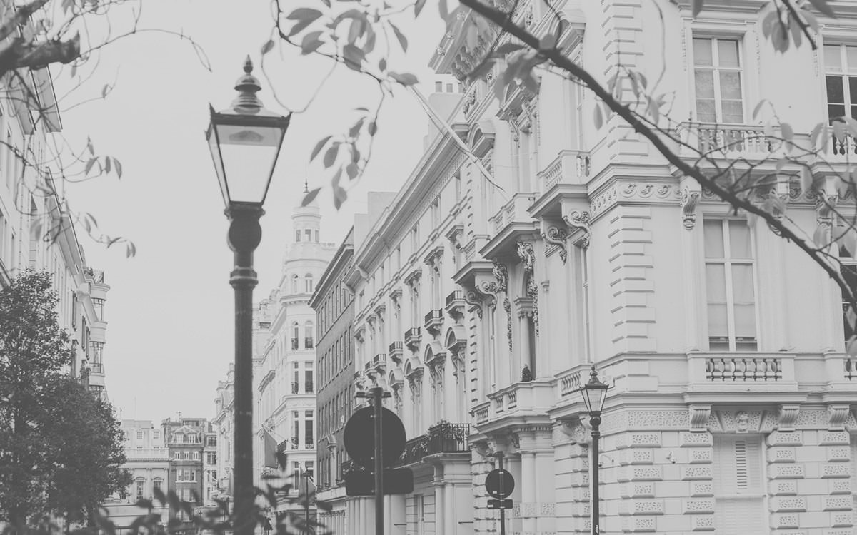 Black and white photo of lamppost and buildings