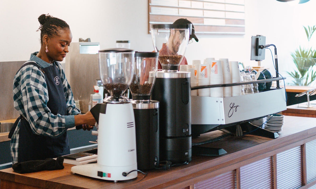 Woman with coffee machines
