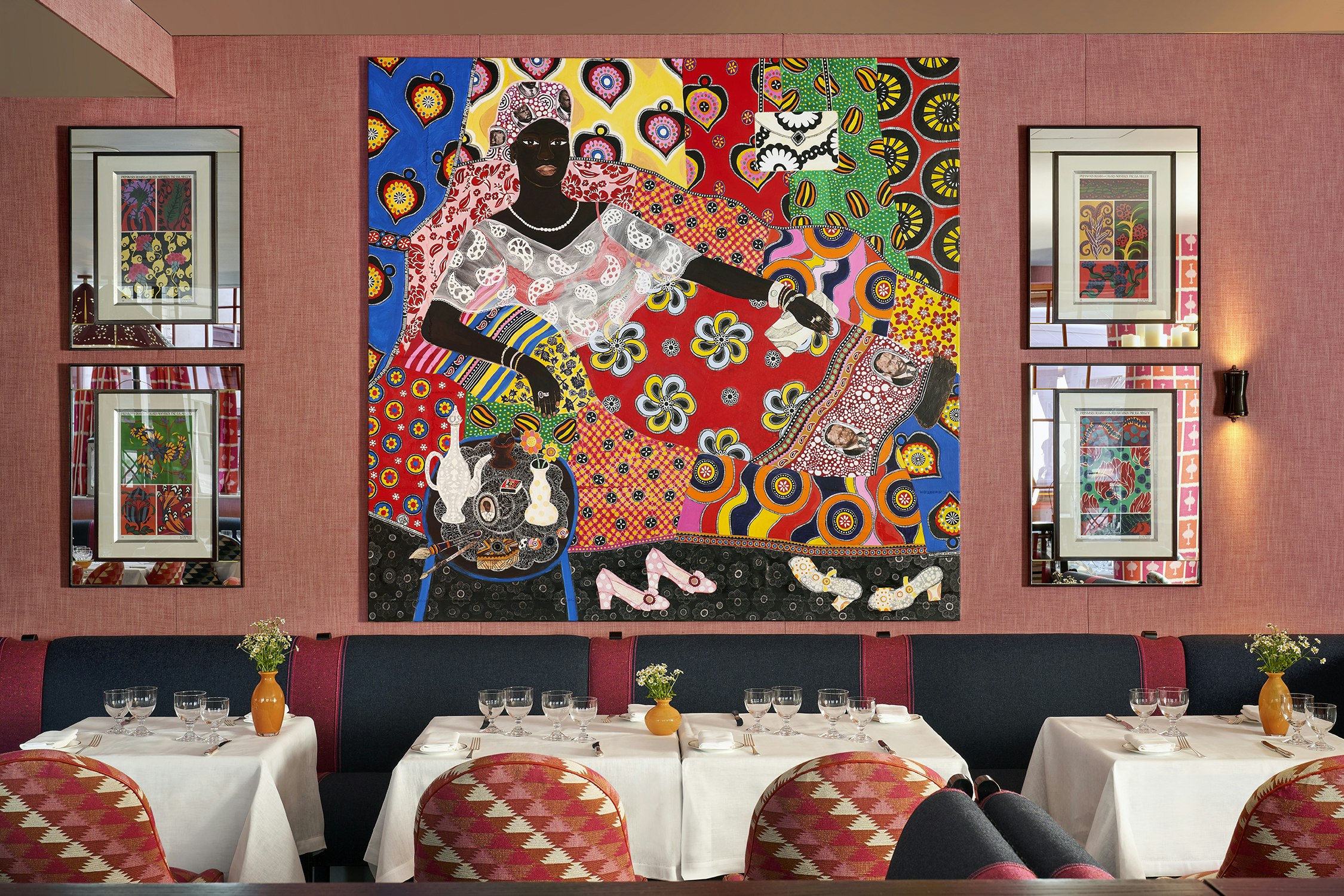 Tables with patterned motif in background on wall