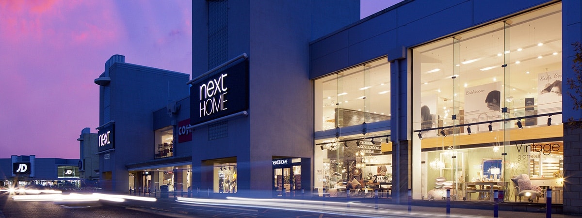 Next Home logo on building at night