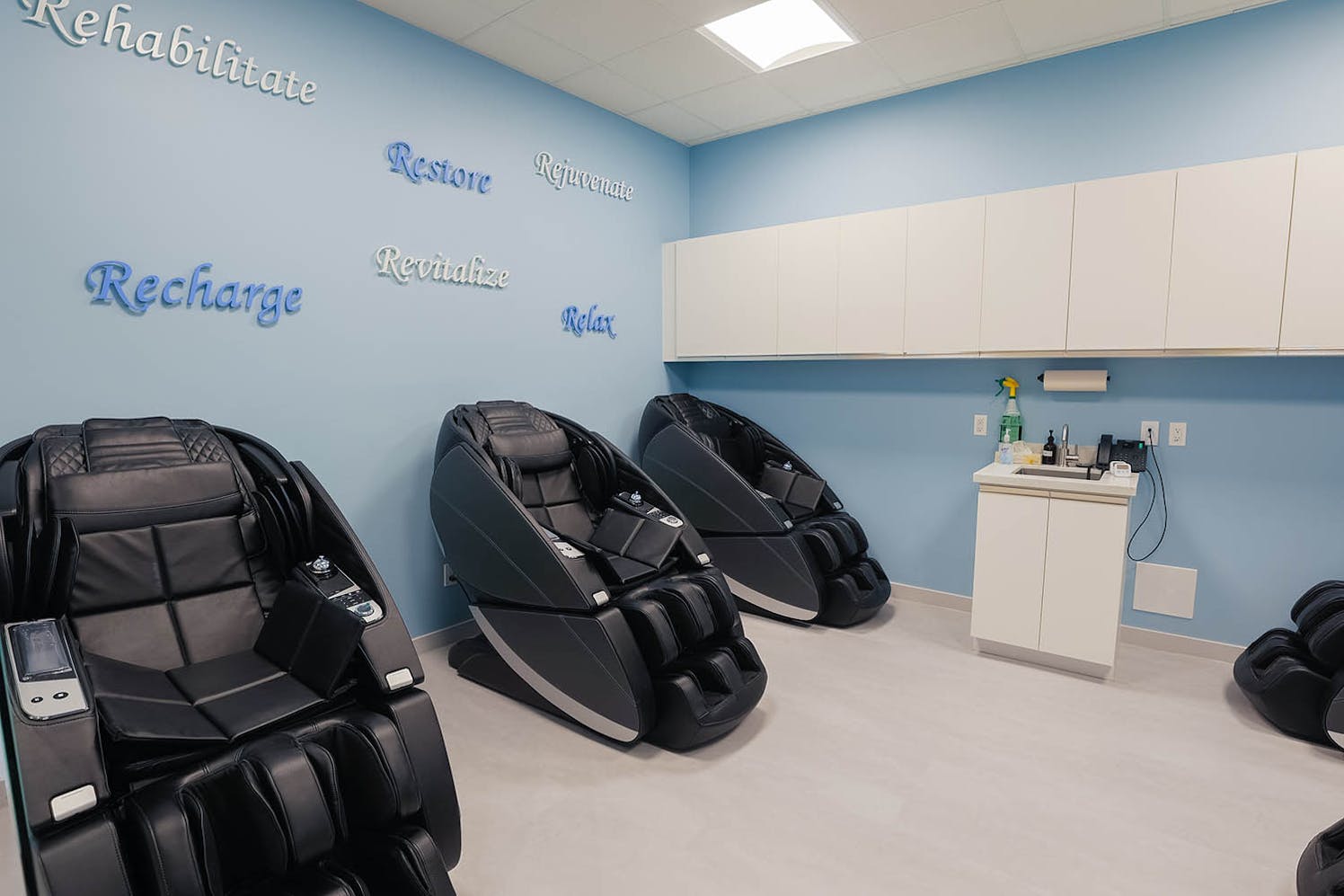 Therapeutic massage chair in a recovery lounge