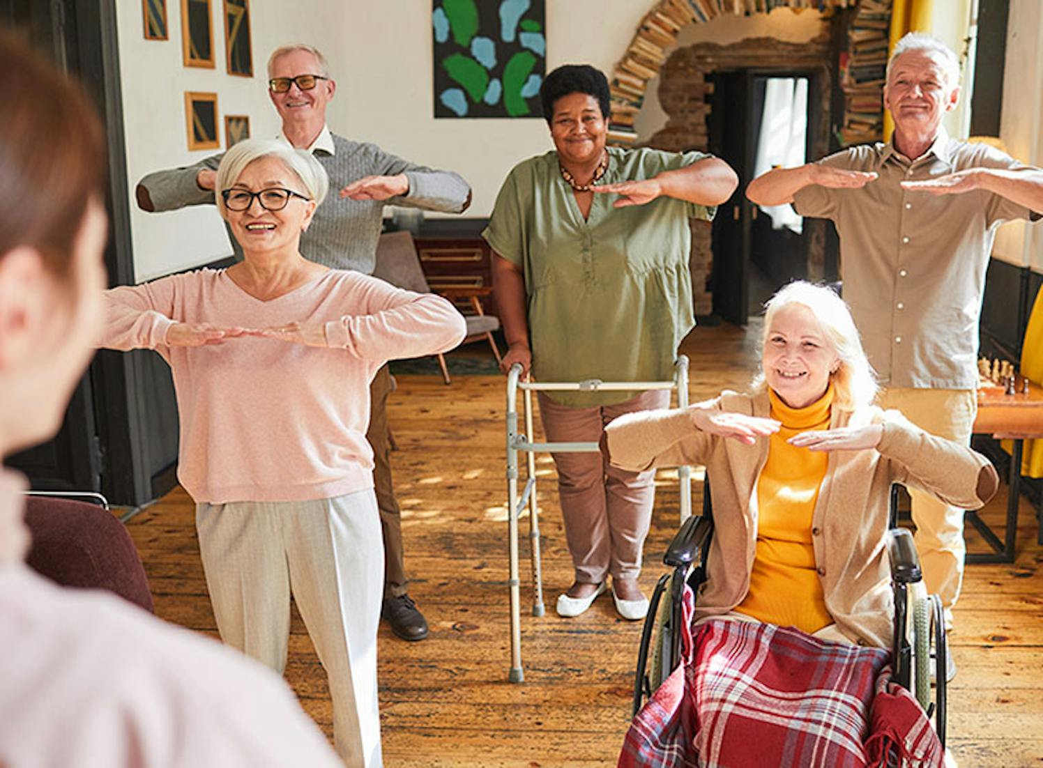 Healthcare professional assisting a senior resident with mobility