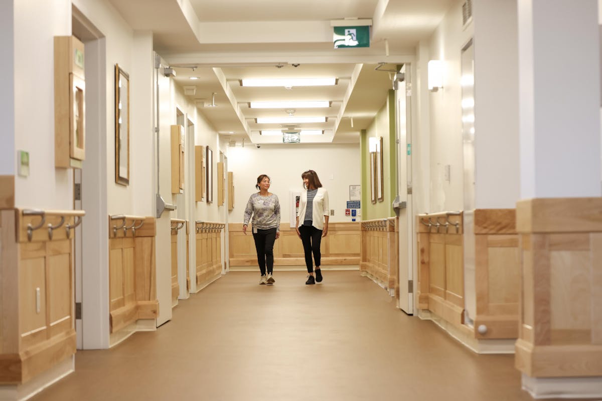 Physiotherapist working with a senior in a care facility