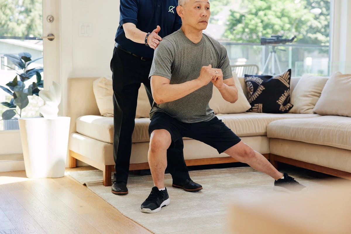 Clinician reviewing a mobility plan in a home setting