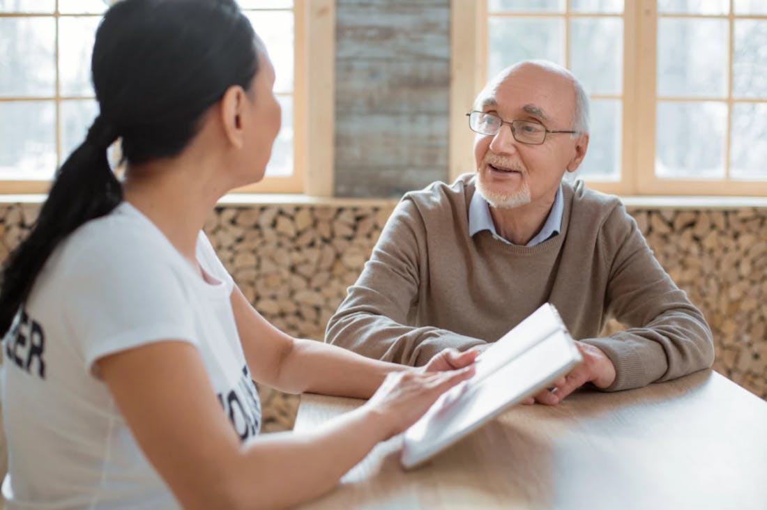 Speech-language pathologist working with an adult client