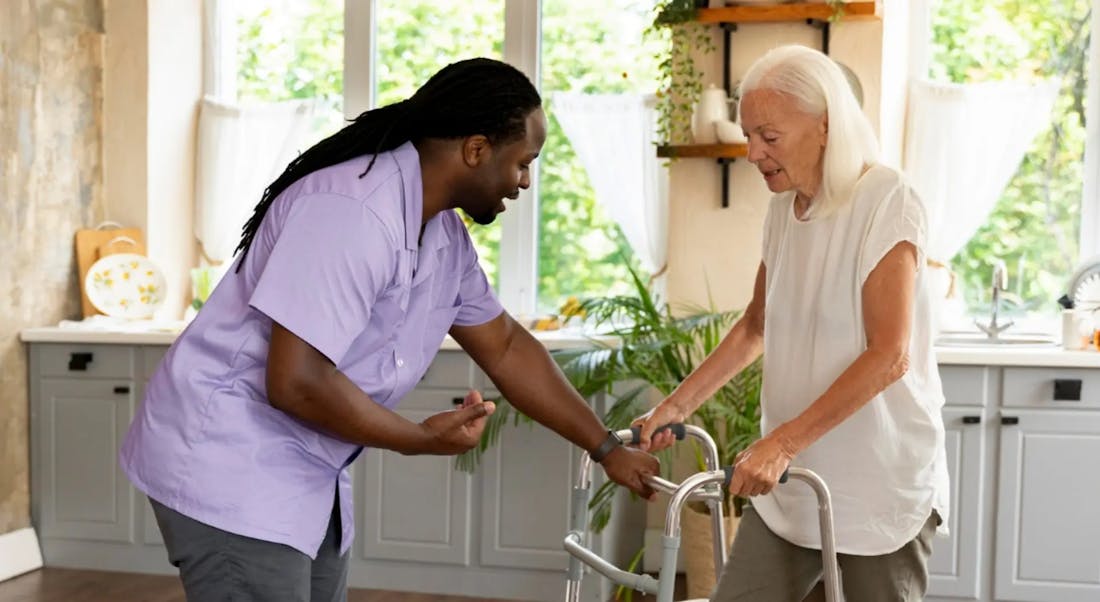Falls prevention program with therapist assisting older adult with balance exercise