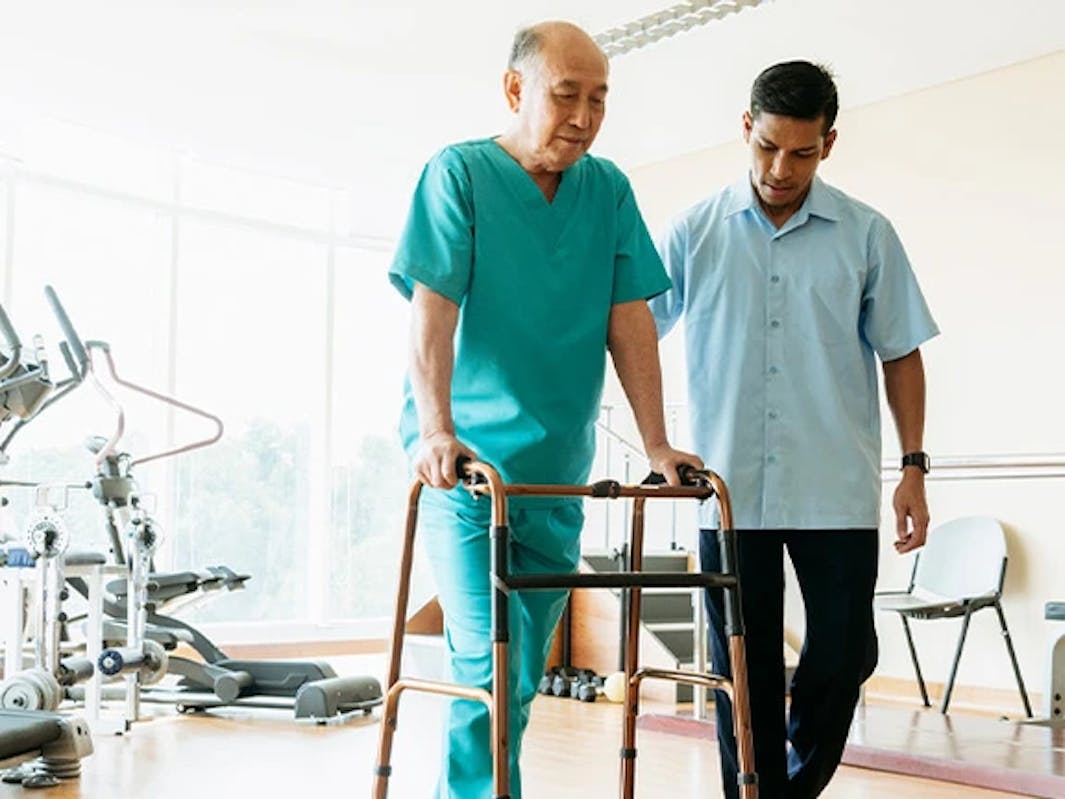 Therapist assisting with mobility exercises