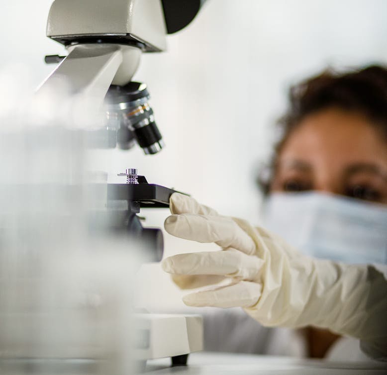 doctor using a microscope
