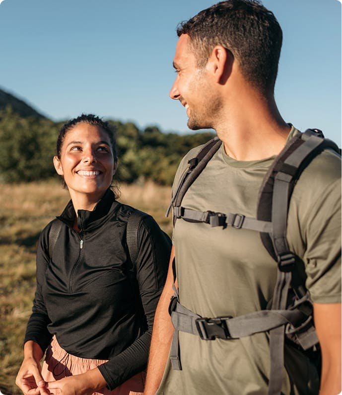 man and woman hiking