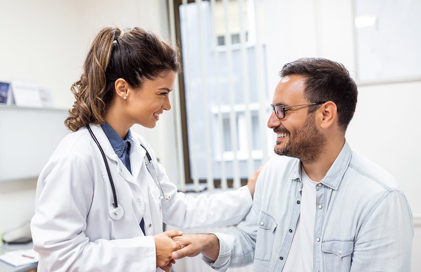 doctor and patient shaking hands