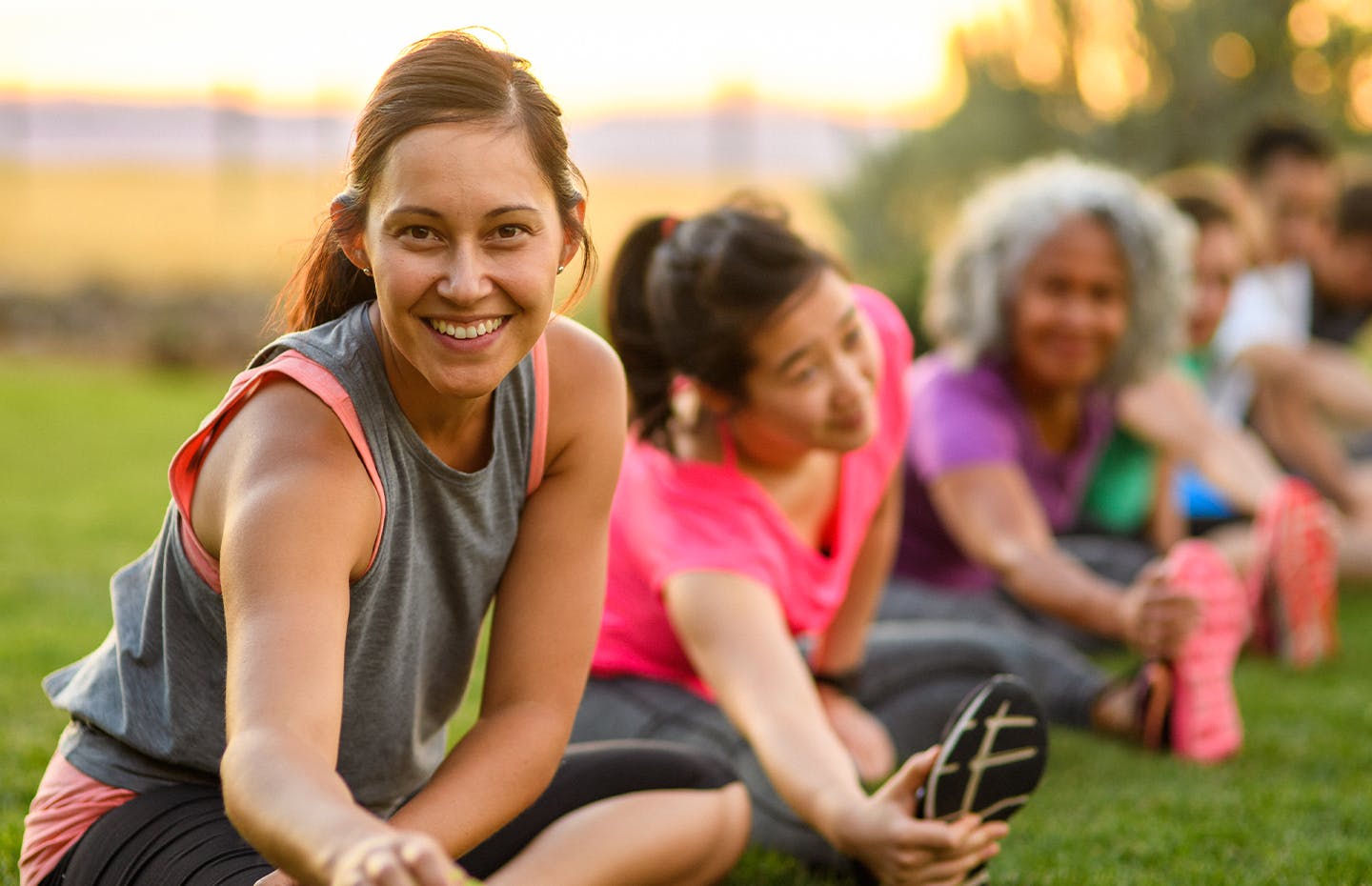 group of women stretching their legs