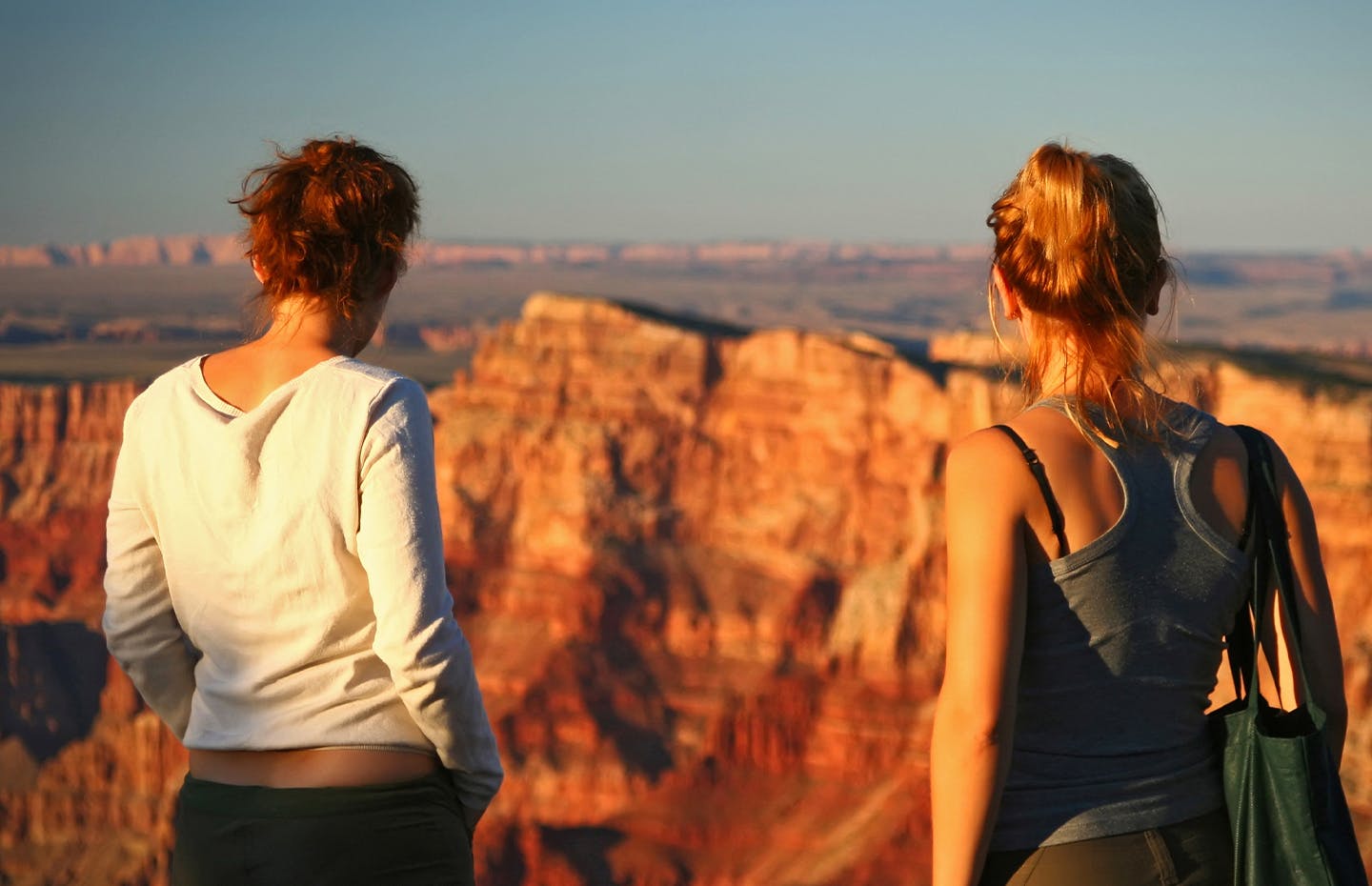 2 women looking out to mountain scape