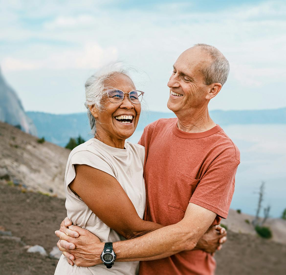 older couple smiling and hugging eachother