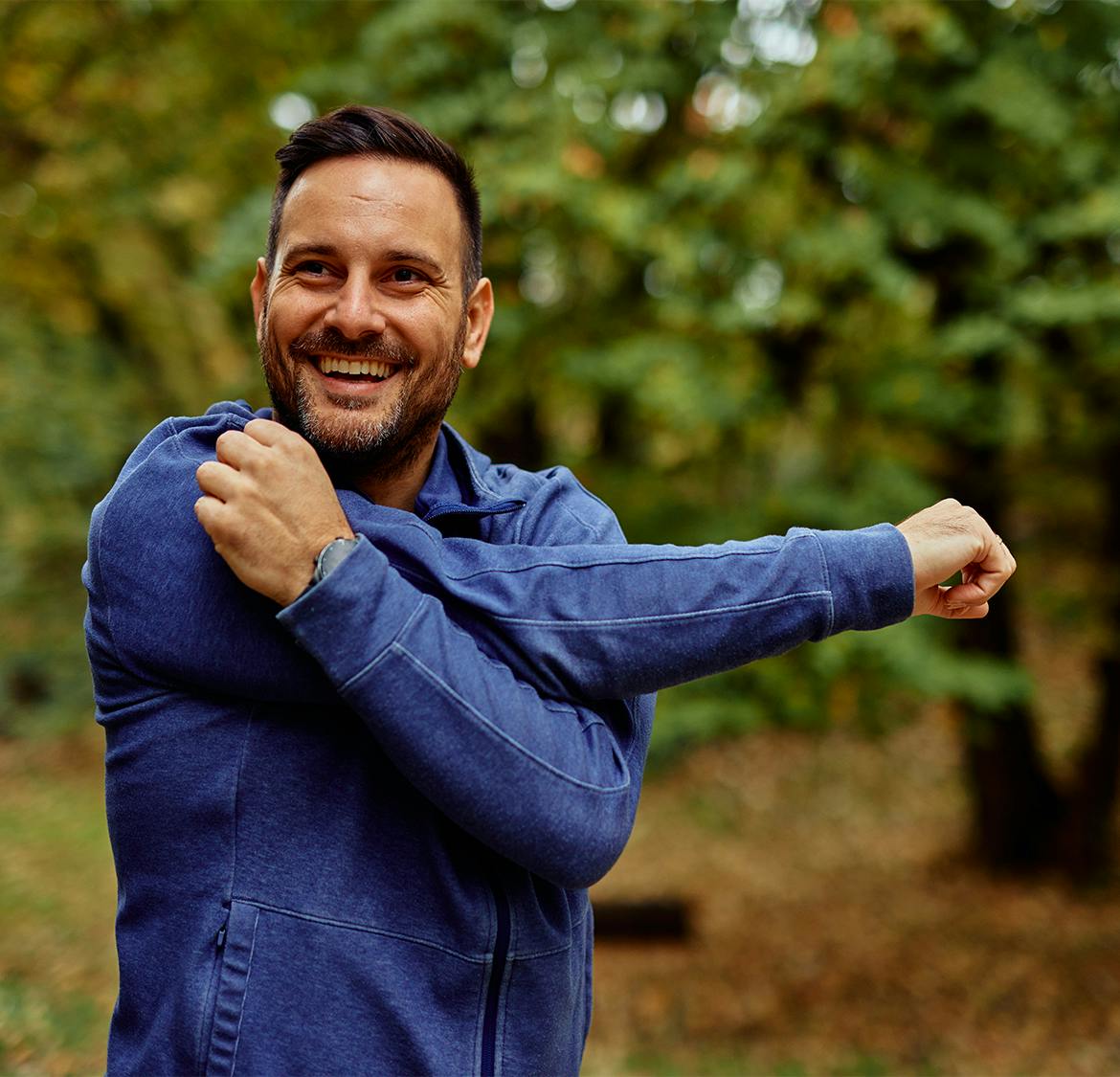 man stretching his arm