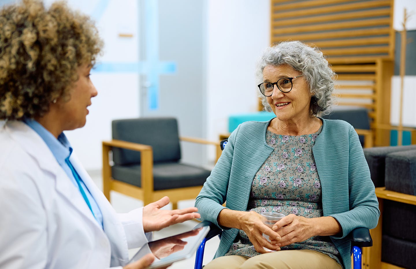 older woman speaking to doctor