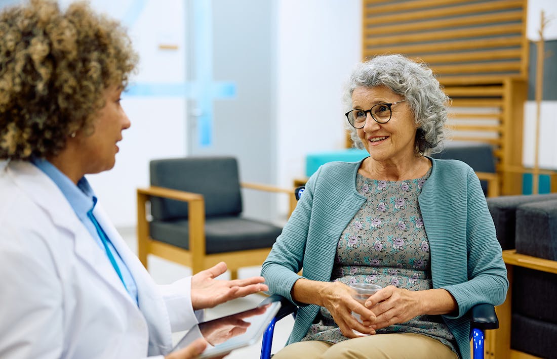 older woman speaking to doctor
