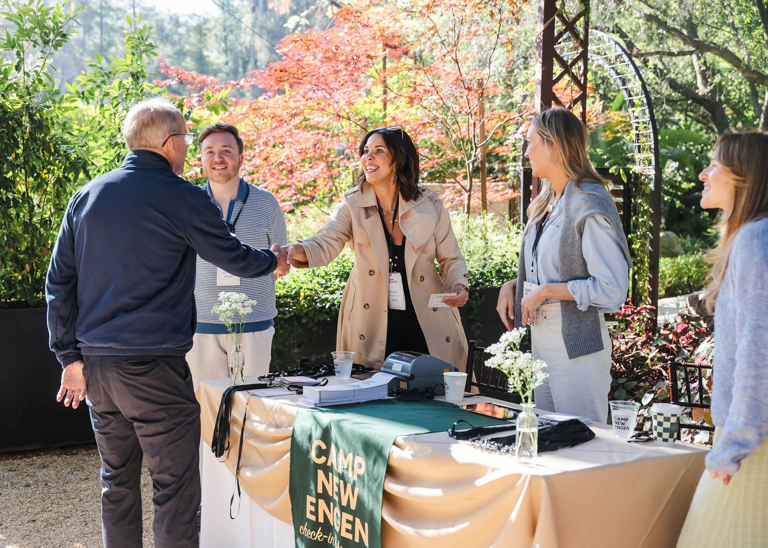 Camp New Engen 2026 Attendee Check-In Attendees checking in and greeting each other at the Camp New Engen 2026 marketing summit in Malibu.
