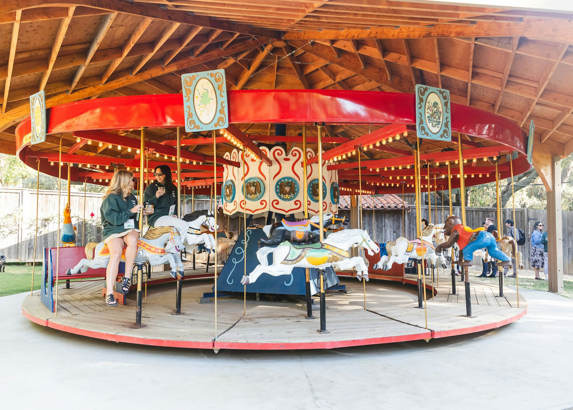 Camp New Engen 2026 Carousel Moment at Calamigos Ranch Camp New Engen 2026 attendees talking on a carousel during the retreat-style marketing summit at Calamigos Ranch.