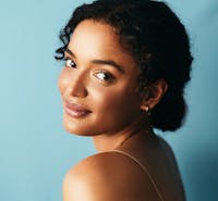 woman with her hair in a low bun