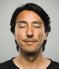 man with his eyes closed