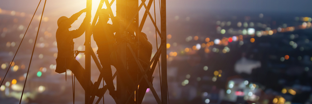Tower climbers at sunset