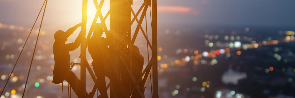 Tower climbers at sunset