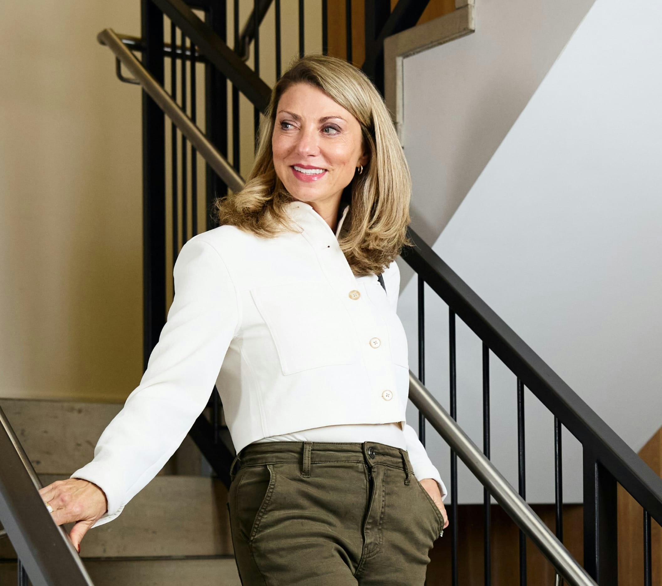 woman walking down a set of stairs