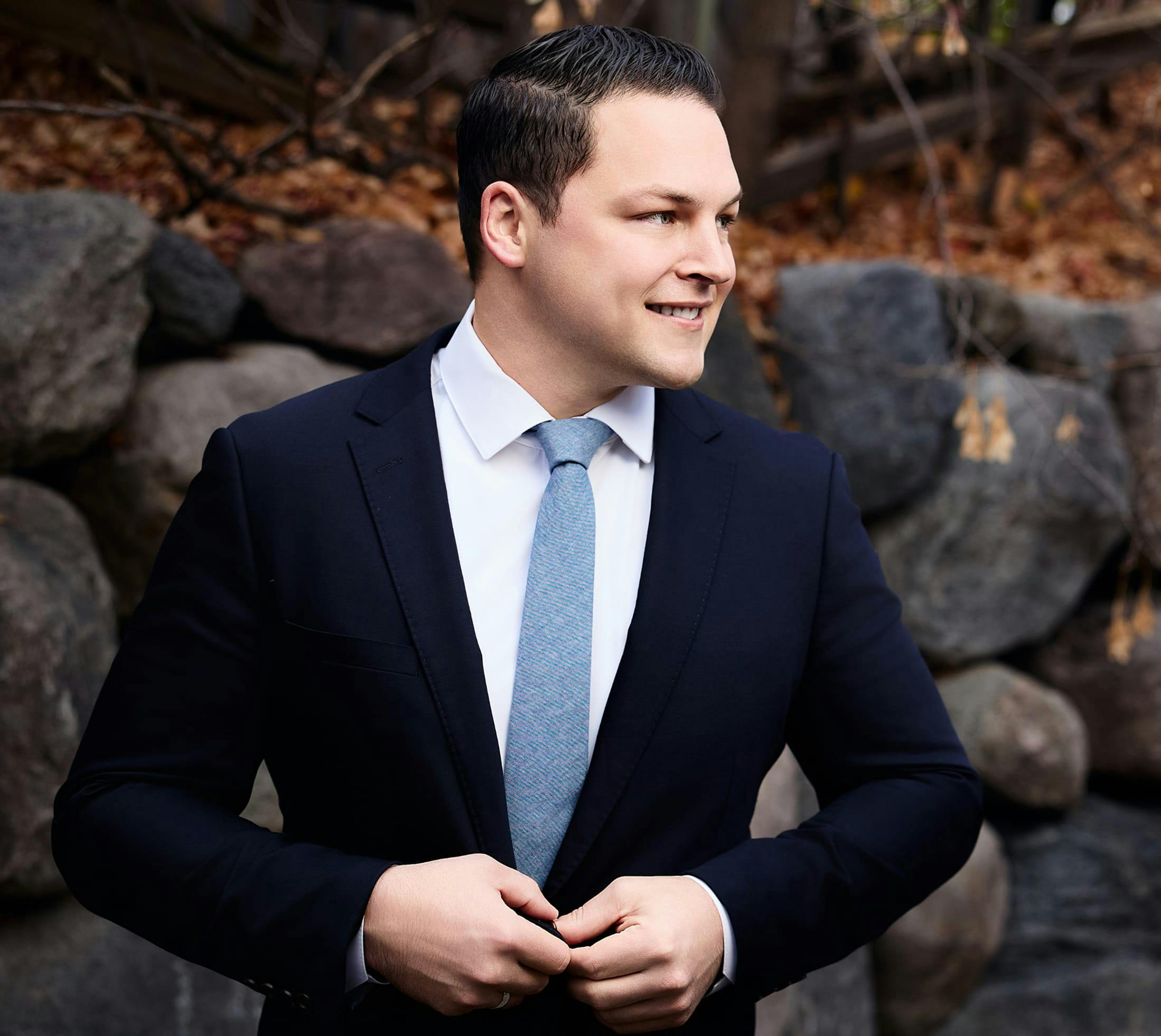 Photo of Dr. Hagen smiling in blue suit and tie