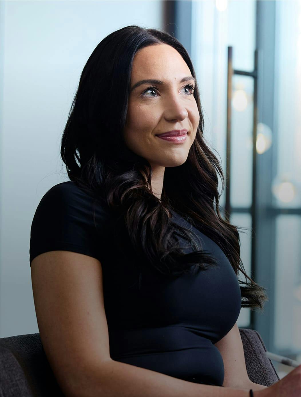 woman with long dark curly hair