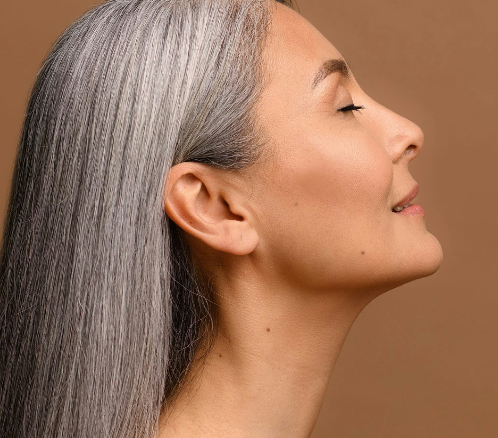 side profile of a woman looking up