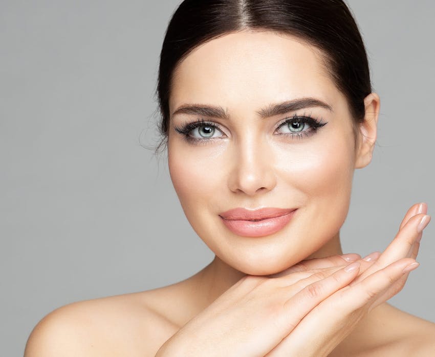 woman couching her chin