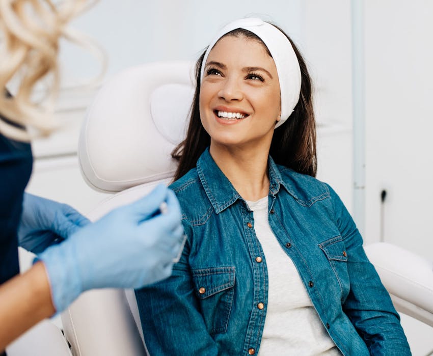 woman smiling at nurse