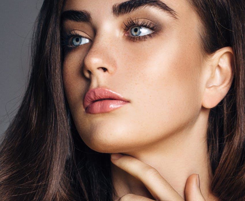 woman touching her chin