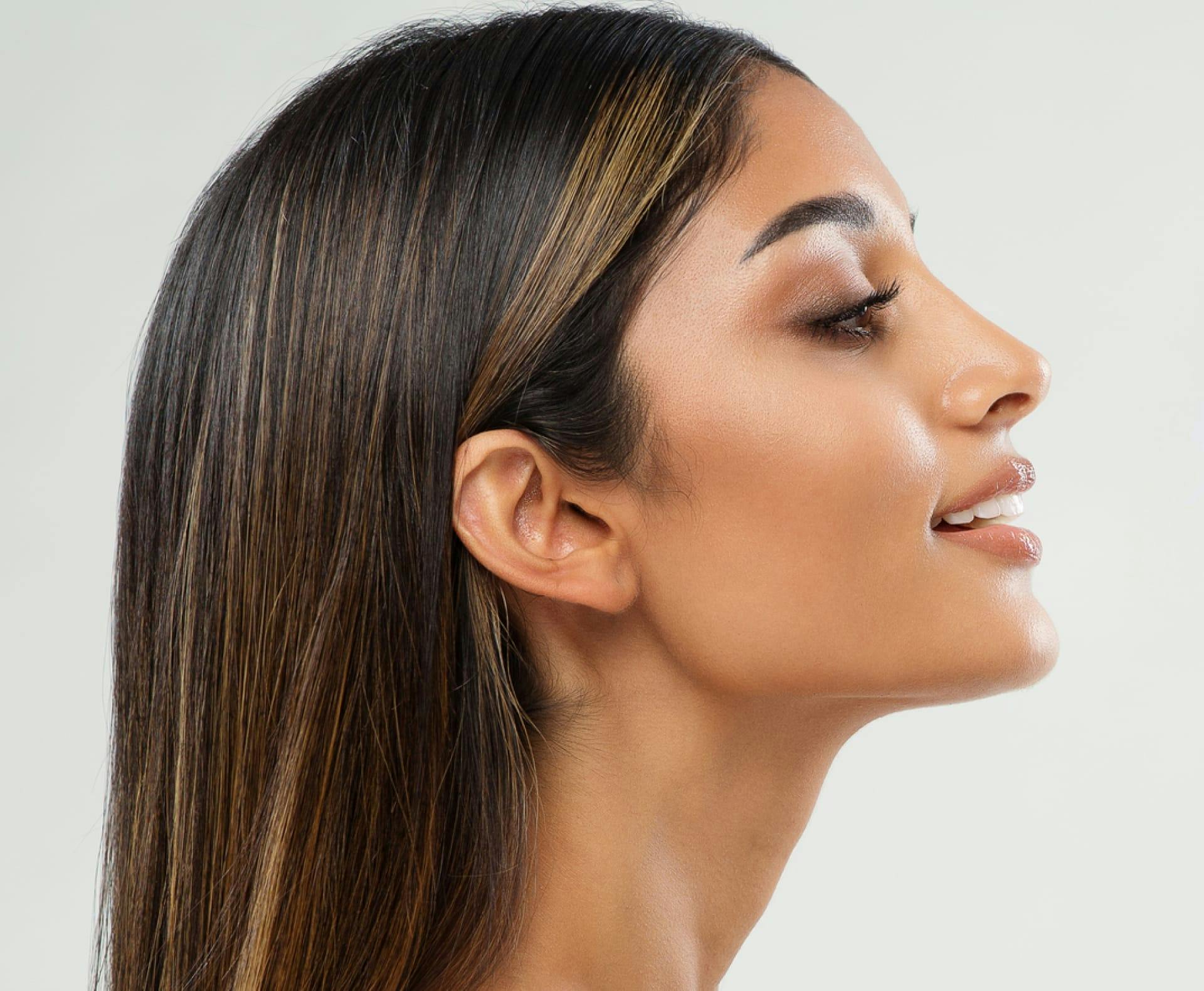 side profile of a woman smiling