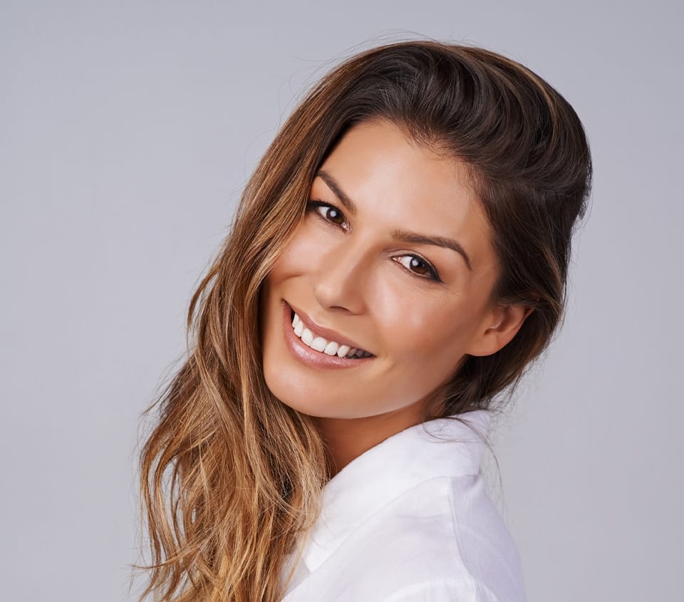 woman smiling over her shoulder