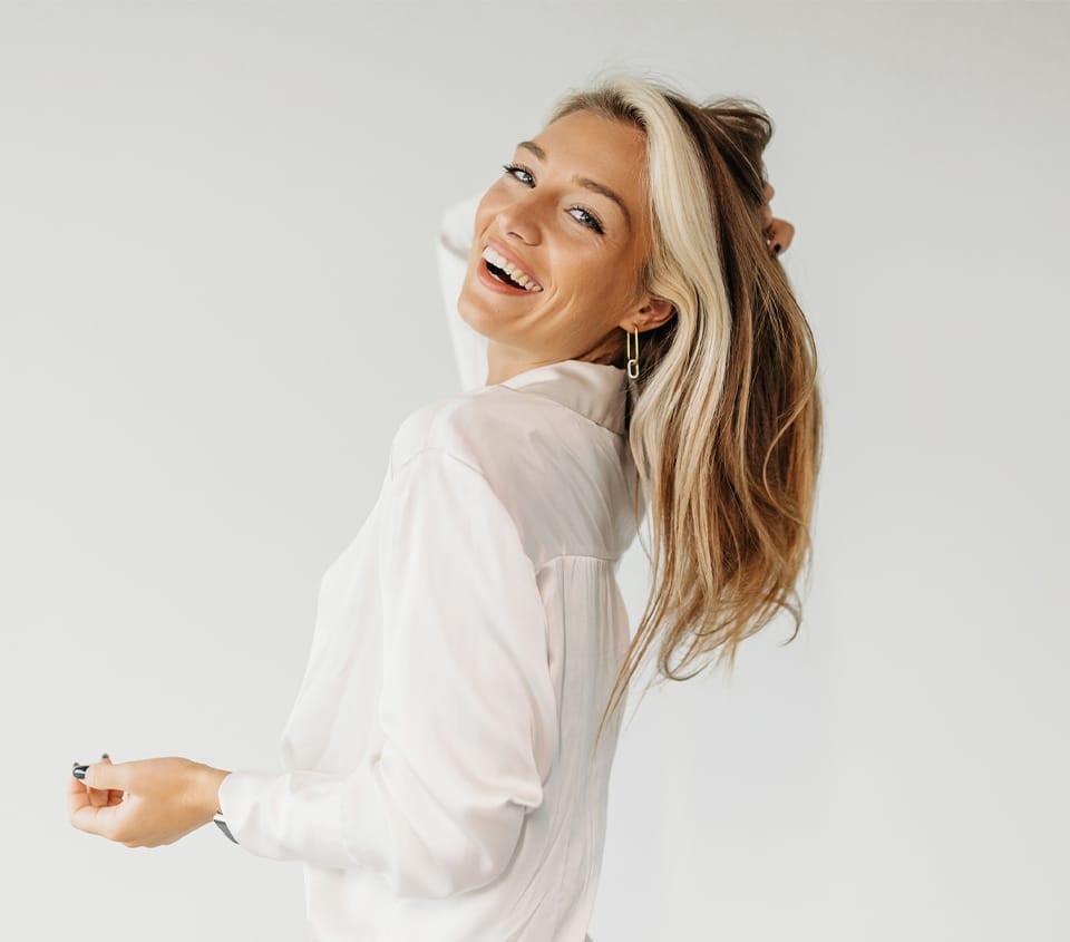 woman with blonde hair wearing a white shirt