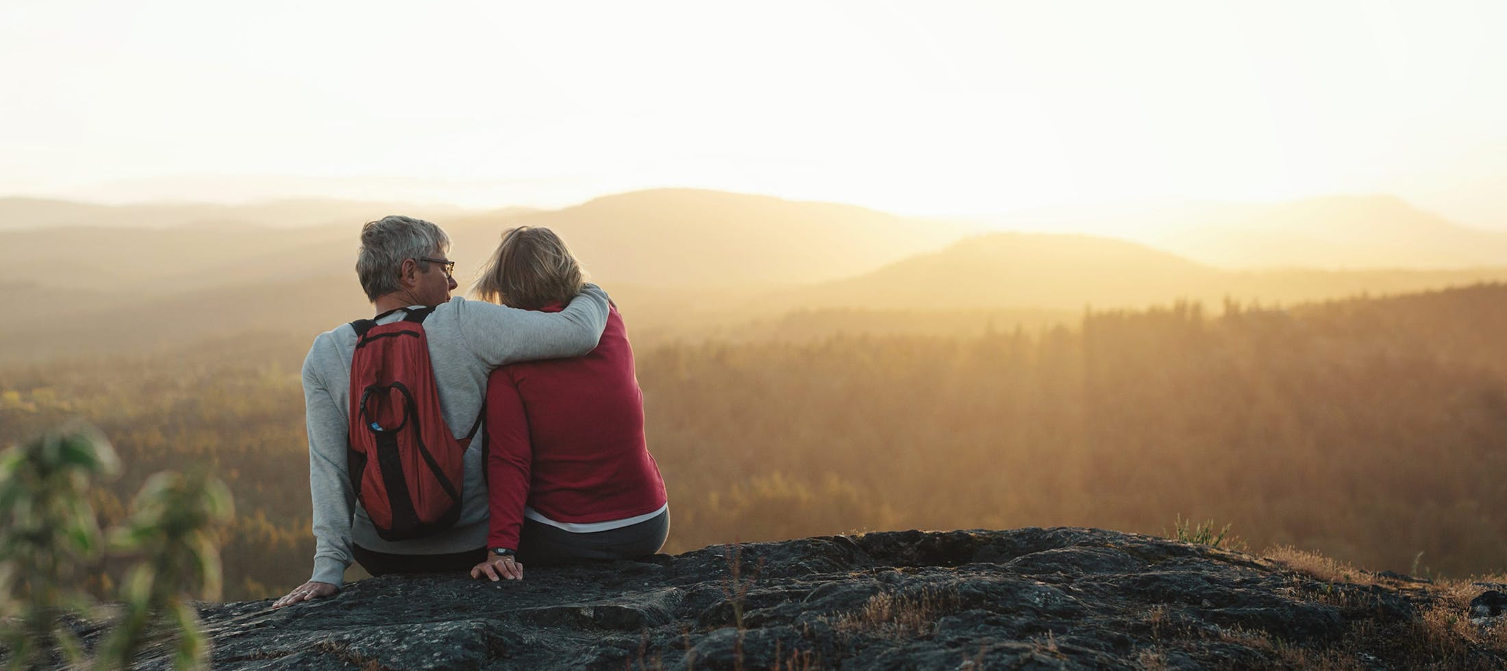 Happy elderly couple hiking
