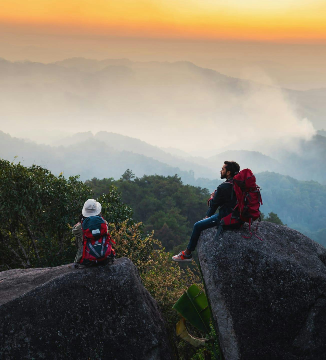 Two mountain climbers sitting