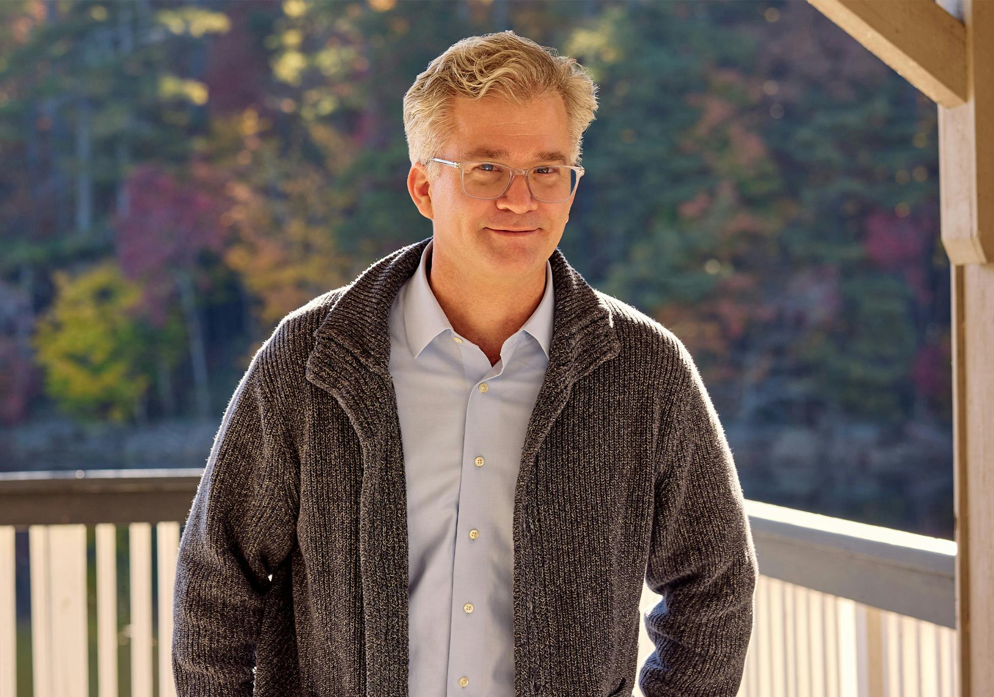 Brad Henry in gray jacket outside on patio