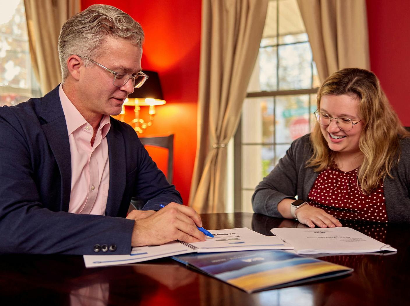 attorney explaining documents to female client